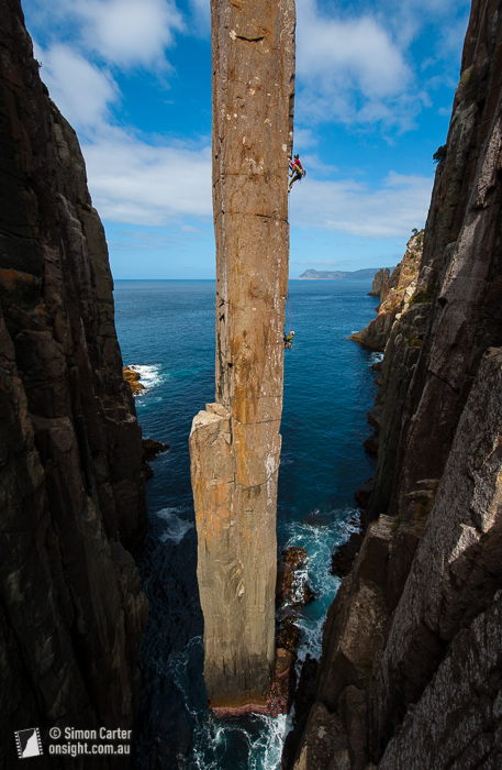 Doug McConnell leading, with Dean Rollins belaying, on The Ewbank Route (aka The Freed Route), which they freed at grade 27 in January 2009, on the 65 metre Totem Pole, at Cape Hauy, Tasmania, Australia.