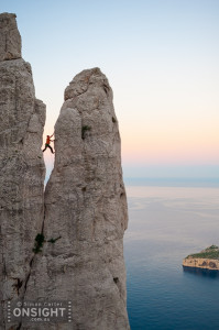 Sunrise finds Nadine Rousselot and Mathieu Geoffray an hours hike in and two pitches up Arête de Marseille (5c). It is a five pitch Calanque’s classic first climbed in 1927, on La Grande Candelle, overlooking the Mediterranean, France.